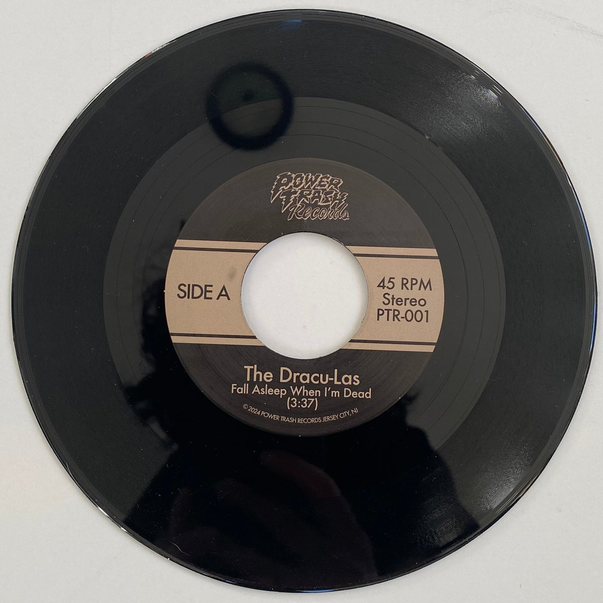 Vinyl record with a label on a white background